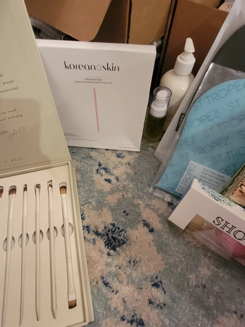 A Box Full Of Many High End Facial Items & Women's 8 Piece White Makeup Brushes